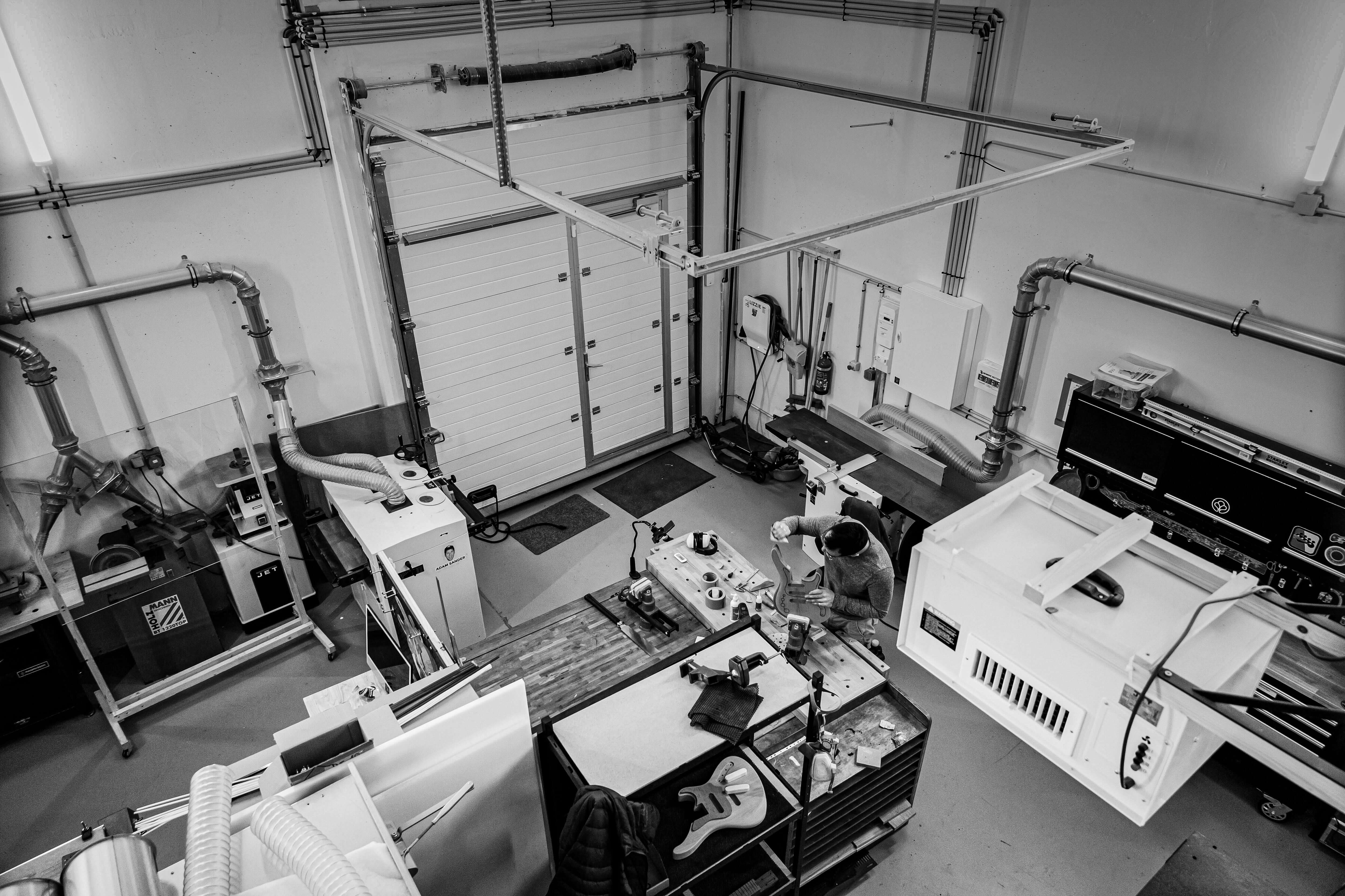 Industrial workshop interior with equipment and machinery, featuring Belforti systems in use.