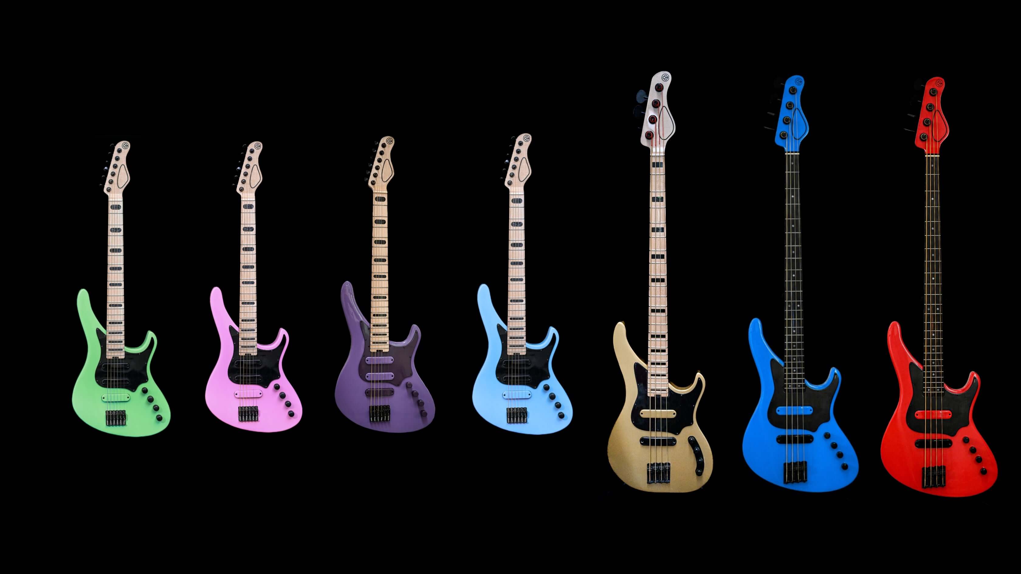 Colorful collection of Belforti electric guitars and basses against a black background, featuring various vibrant hues like green, pink, and blue.