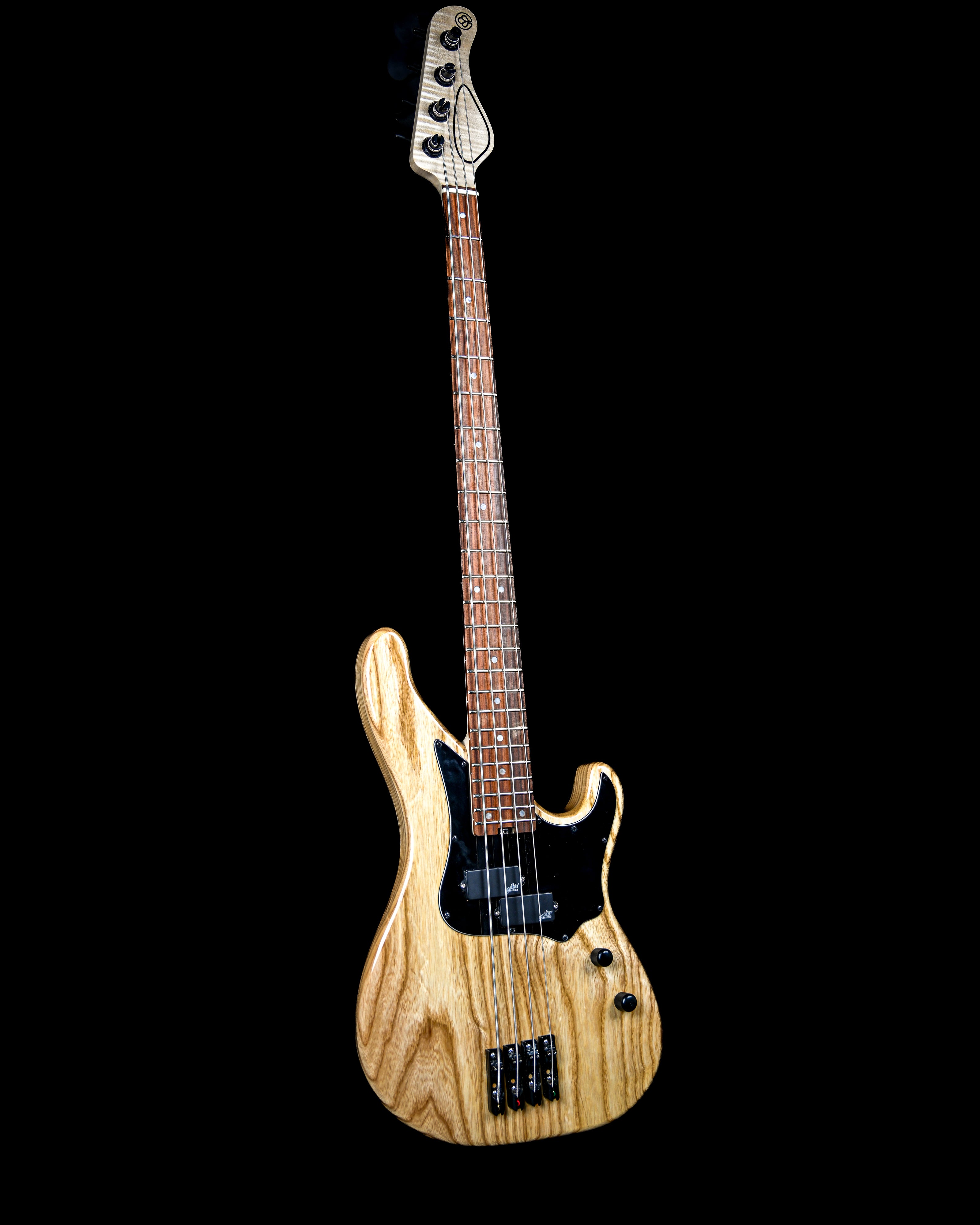 A full view of a Belforti Vea 4 Essential, custom bass with a natural finish made in france