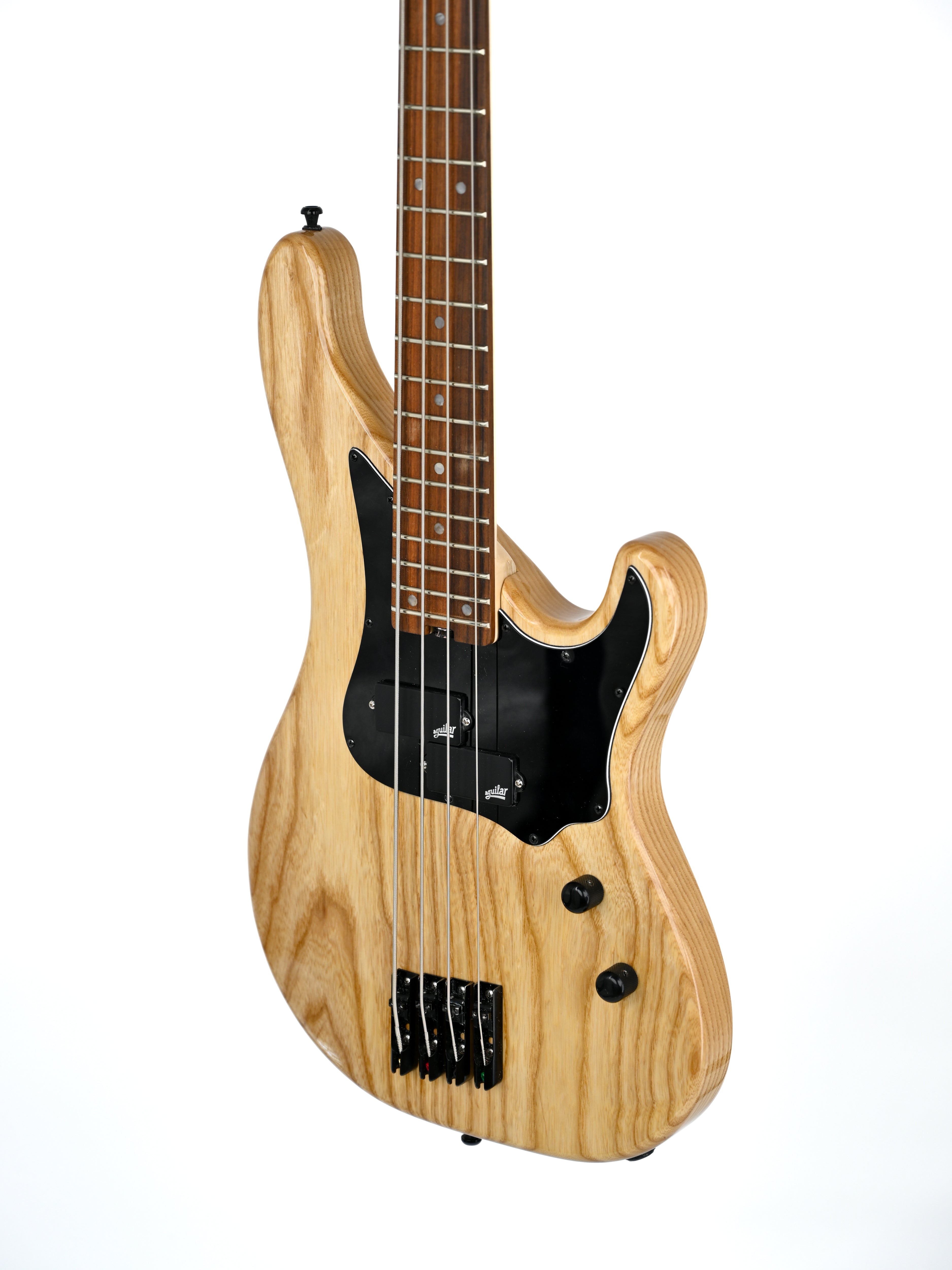 Natural wood Vea electric bass guitar from Belforti Paris with black pickguard and four strings, isolated on white background.