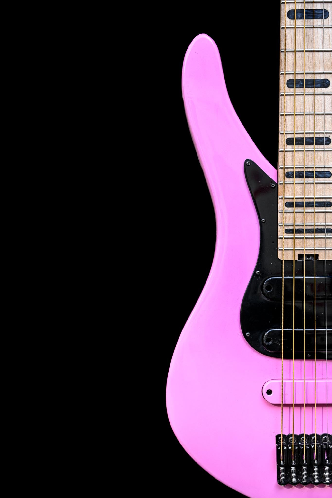 Cropped view of a Belforti E5 Blackpink Guitar, with the famous Kpop group signature colors