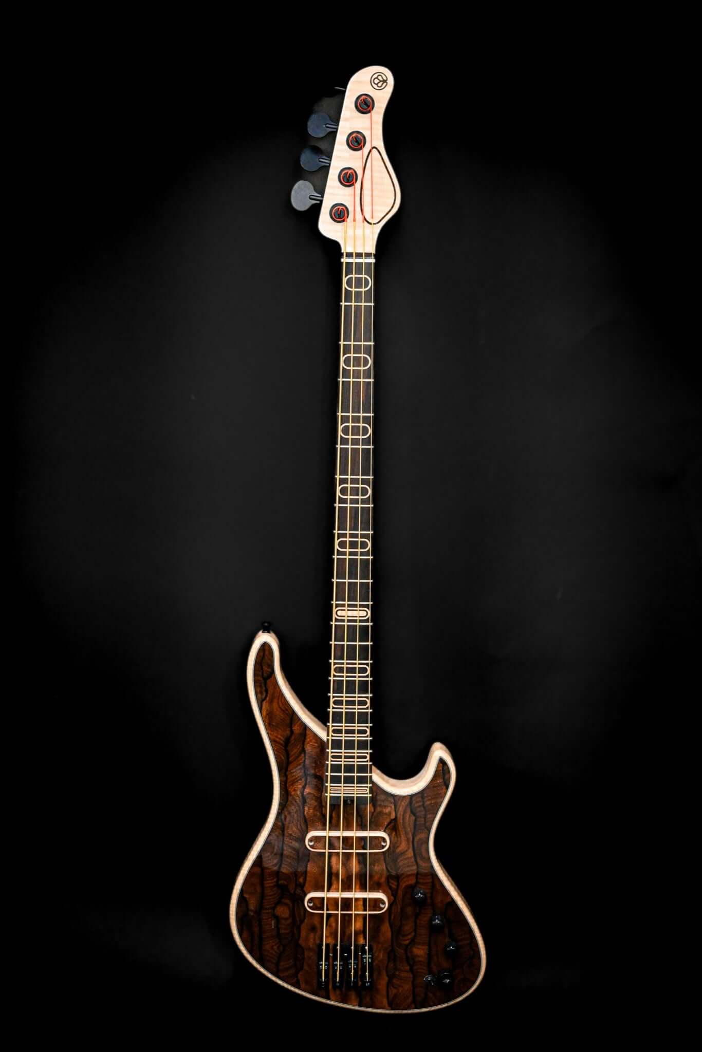 S1 Ziricote electric bass guitar featuring a striking ziricote top with deep organic textures, designed for exceptional resonance and playability.