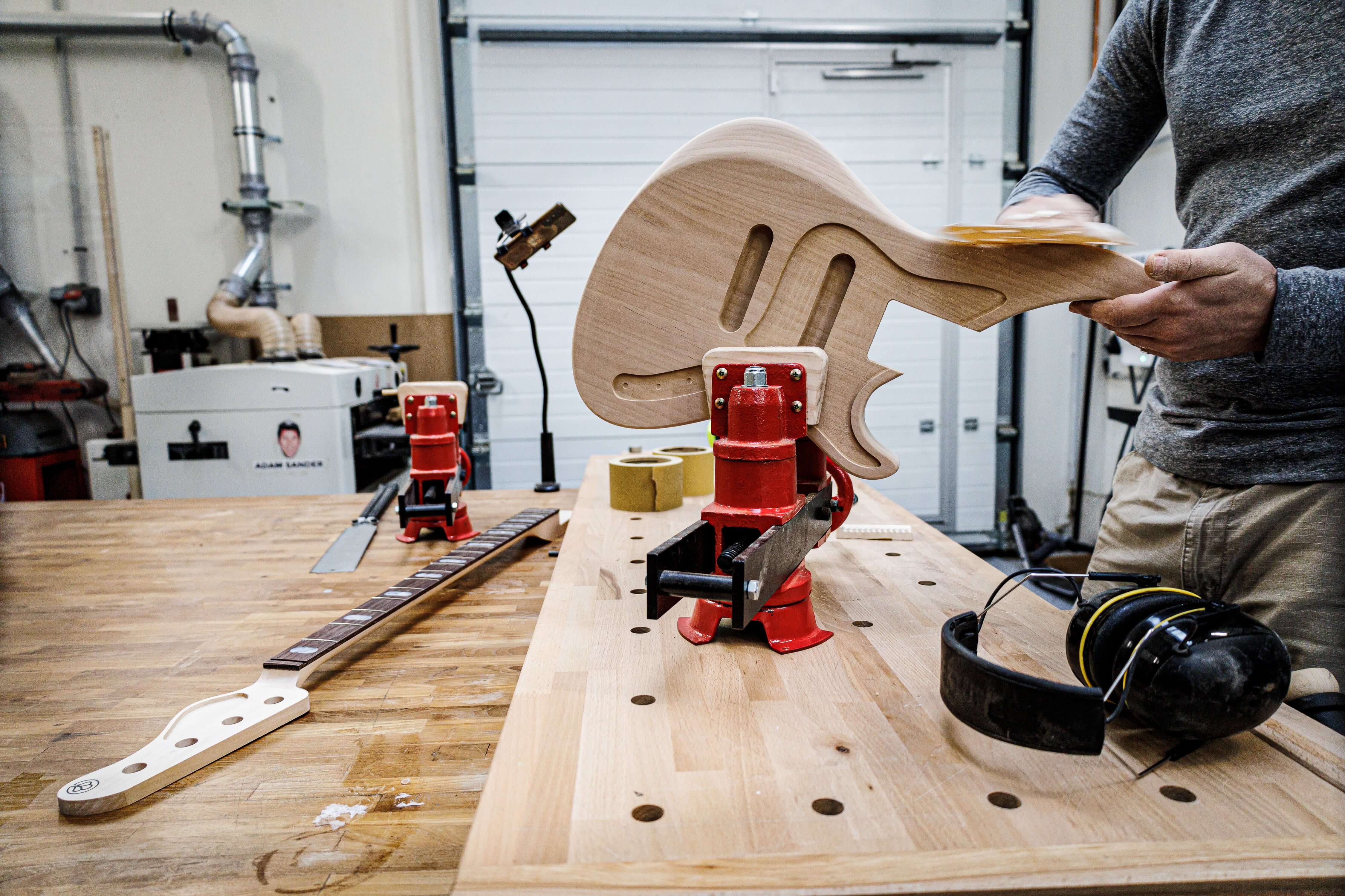 3 Weeks Guitar & Bass Building Course in Paris at Belforti workshop, showing guitar assembly process with premium woods.