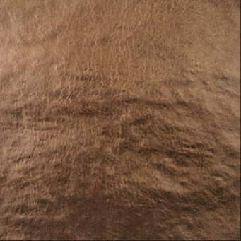 Close-up of brown leather texture with natural grain patterns suitable for upholstery and fashion design.