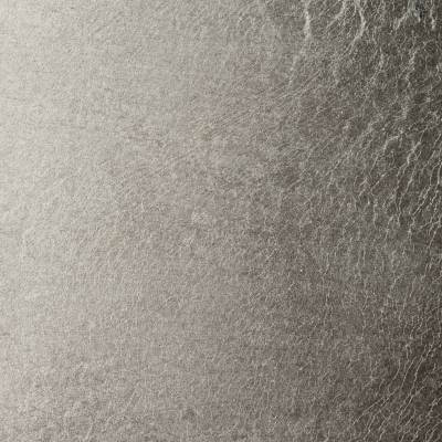 Close-up of textured silver metal surface with subtle patterns