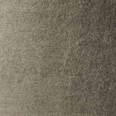 Textura en primer plano de una superficie de material fibroso gris, que muestra detalles y patrones finos.