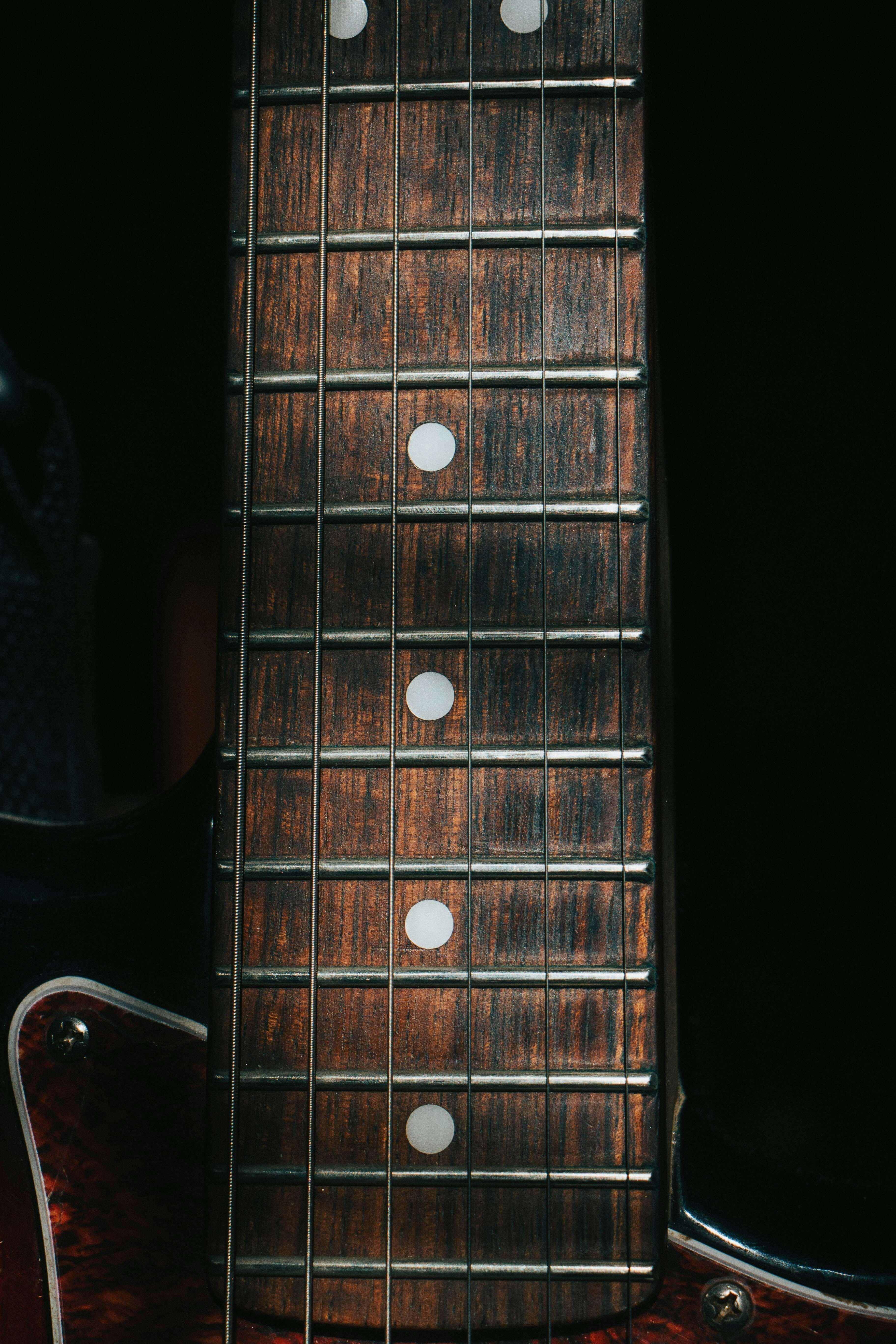 Close-up of guitar neck illustrating Truss Rods and Neck Relief: A Luthier’s Guide to Guitar Setup.