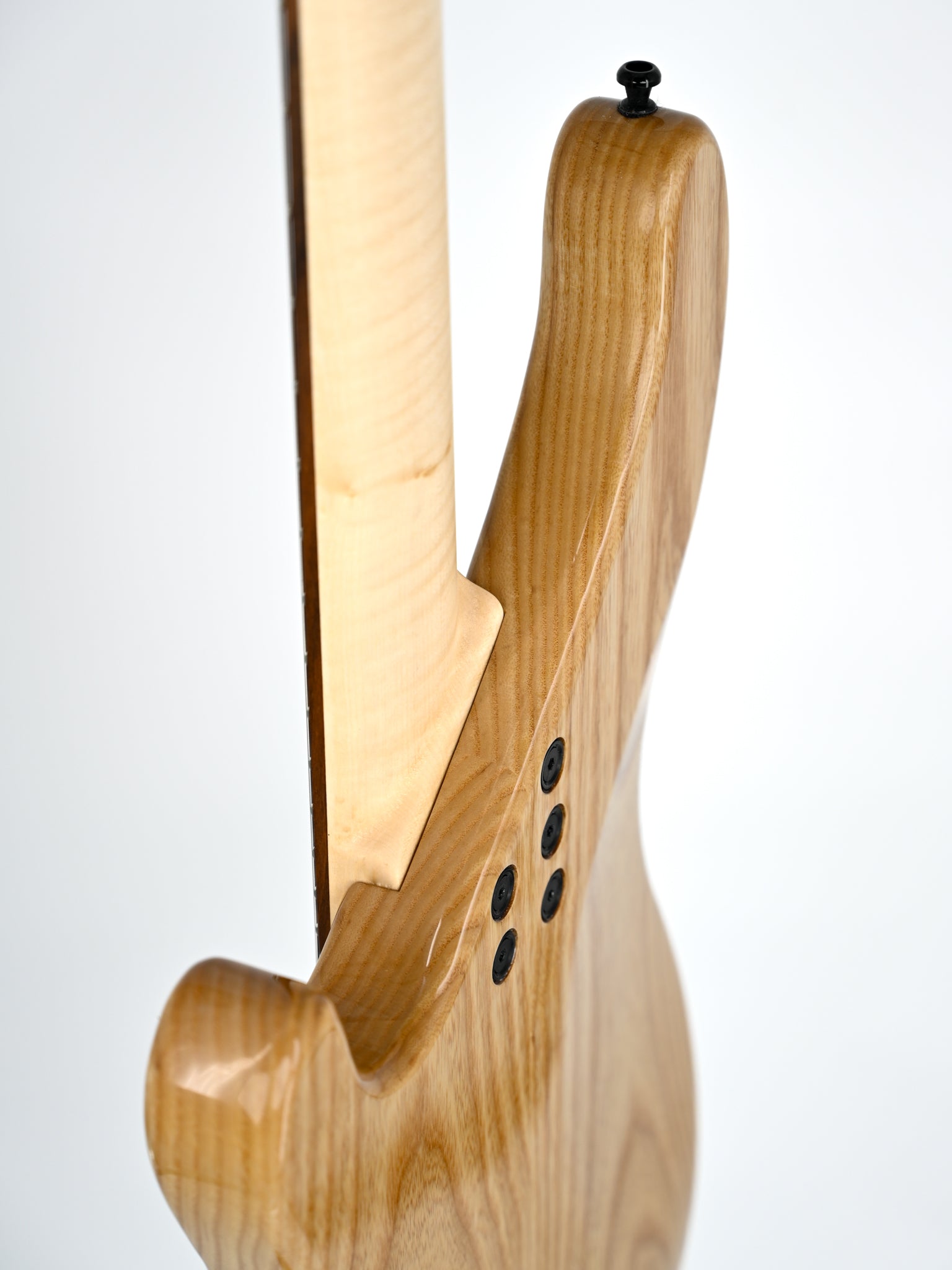 Rear view of a Belforti guitar body highlighting the wood grain and design details.