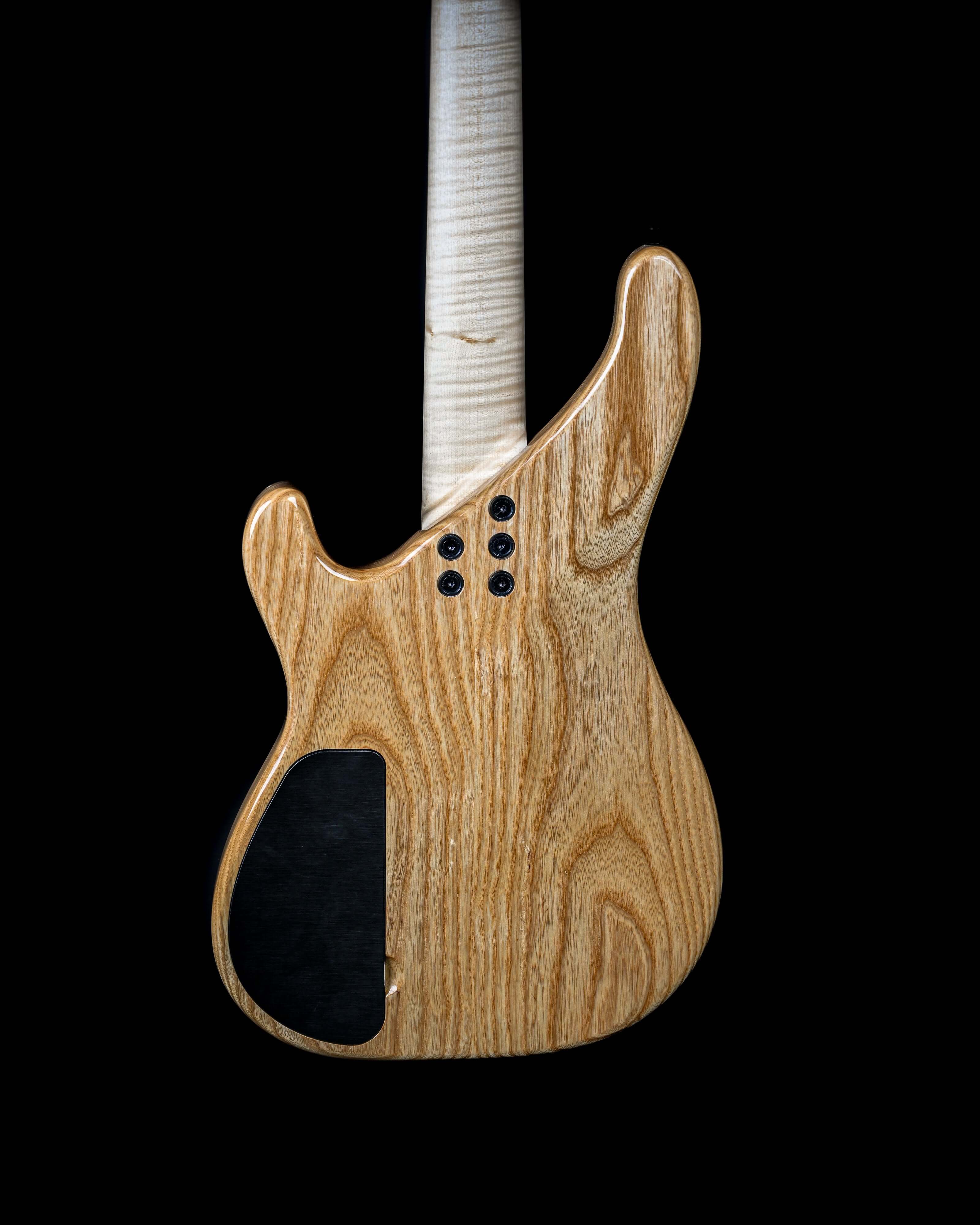 Vēa 4 - Essential bass guitar back view showcasing luxury boutique Belforti design with custom high-end tonewoods.