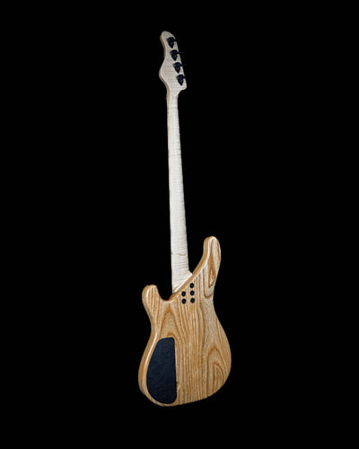 Back view of Vēa 4 - Essential bass guitar by Belforti, highlighting its custom, boutique design with high-end luxury tonewoods.