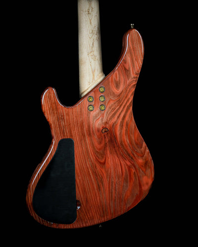 Marē 4 - Signature custom bass guitar by Belforti Instruments, showcasing boutique craftsmanship with luxury wood finish.