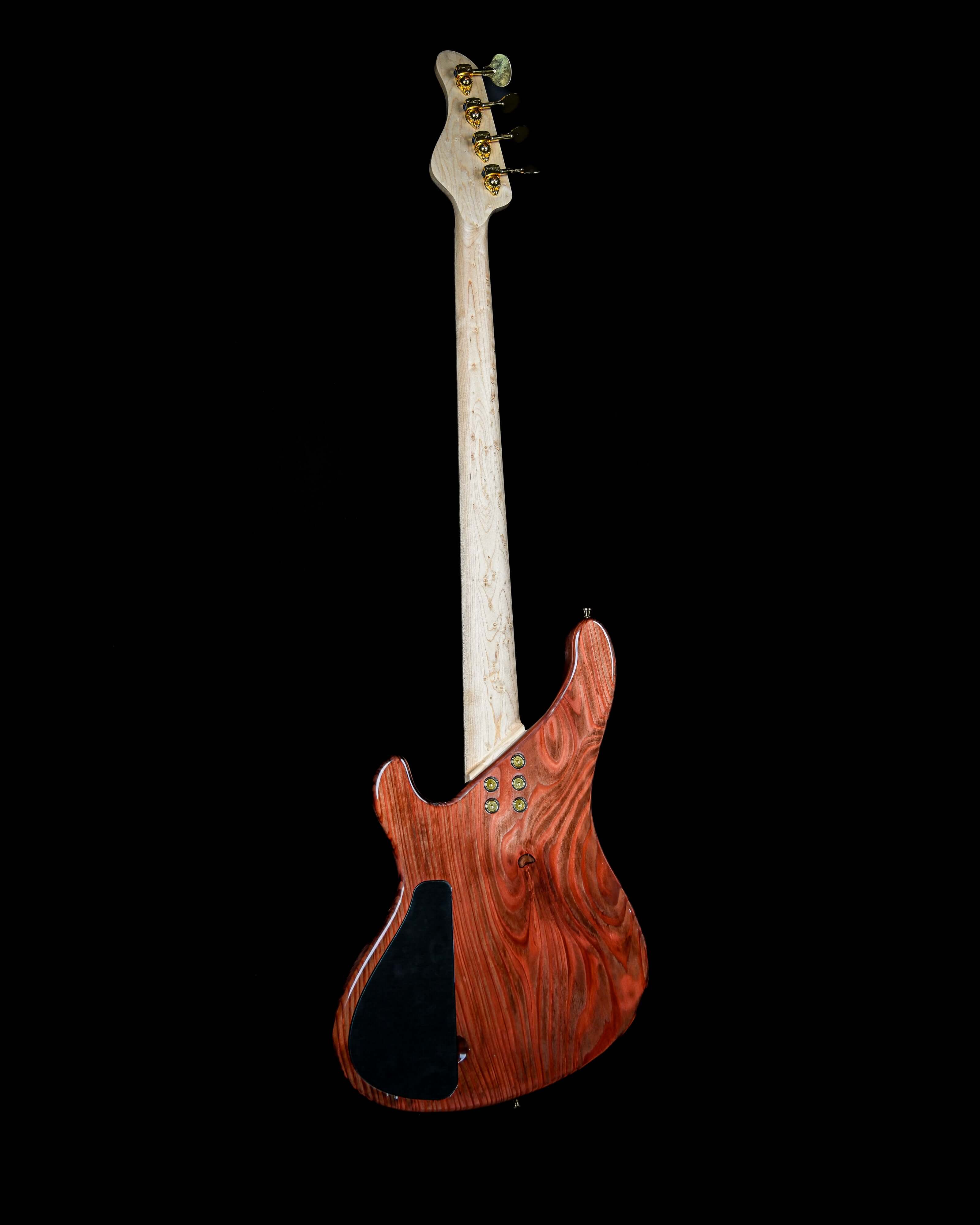Marē 4 - Signature bass guitar by Belforti, custom boutique high-end luxury instrument with intricate wooden body design.