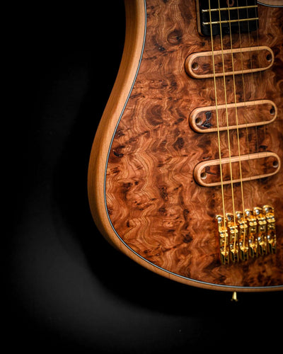 S5 Active - Elm Burl guitar's body and bridge area highlighting craftsmanship and premium quality.