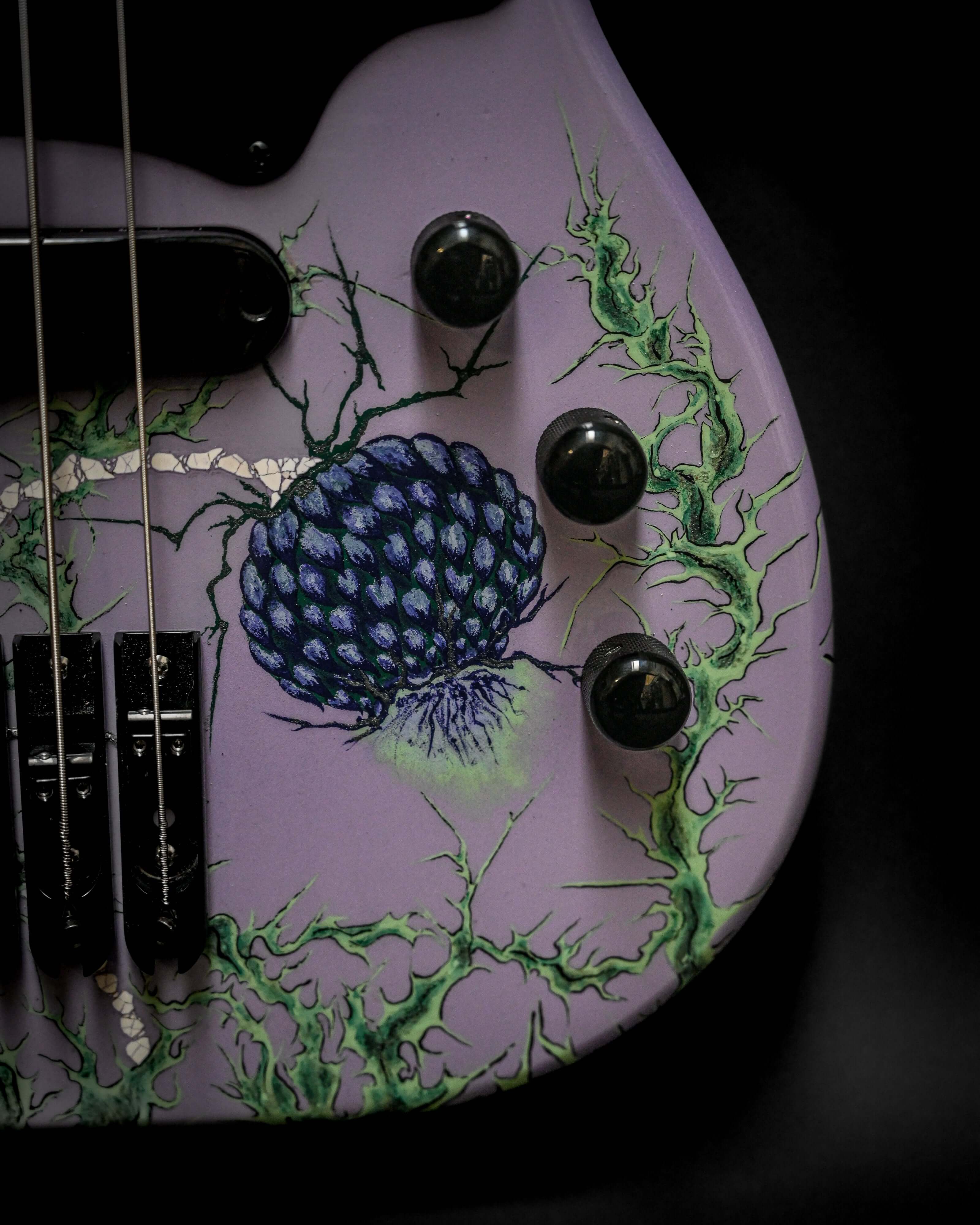 Vēa 5 - Essential bass guitar by Belforti, showcasing custom high-end boutique luxury design with intricate artwork on the body.
