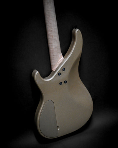 Rear view of Vēa 4 - Essential bass guitar showcasing tonewood body and neck.