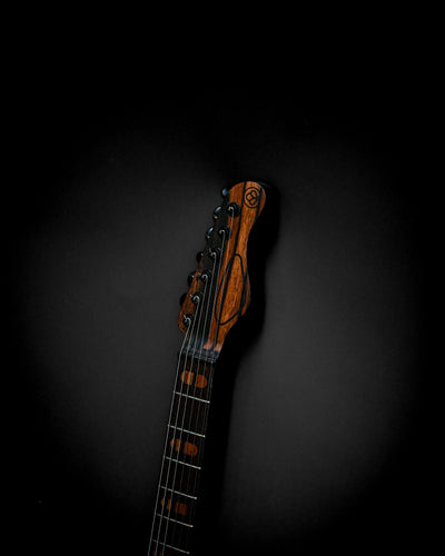 Sarā 6 - Masterbuilt custom electric guitar headstock, showcasing premium craftsmanship and bespoke hardware design.