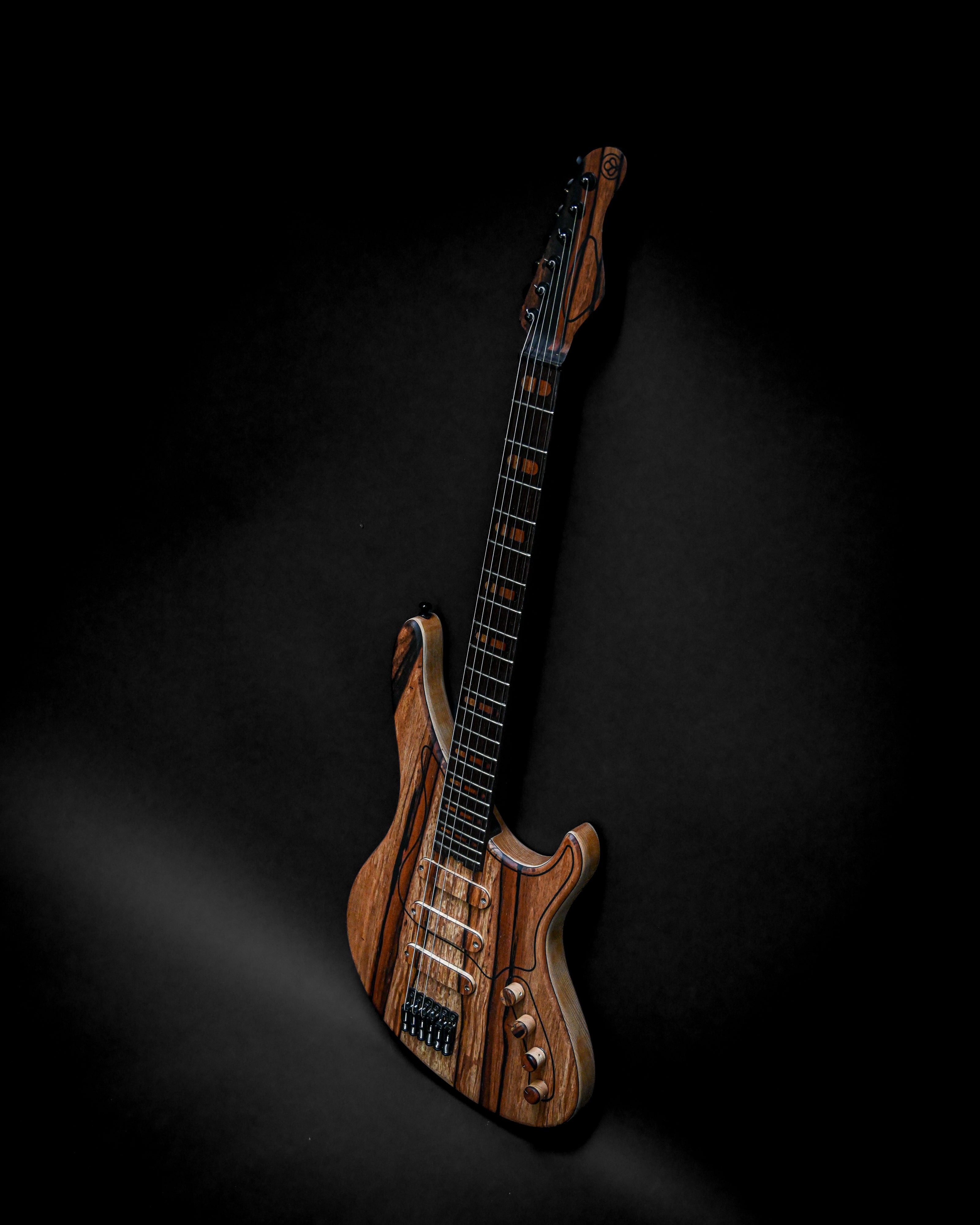 Sarā 6 - Masterbuilt custom electric guitar made with premium tonewoods and bespoke hardware, offering superior refinement and performance.
