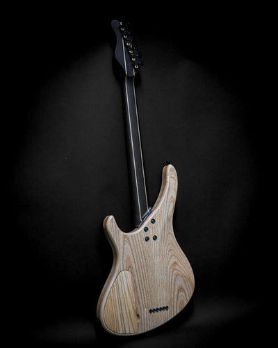 Sarā 6 - Masterbuilt custom electric guitar back view showcasing natural wood finish and craftsmanship