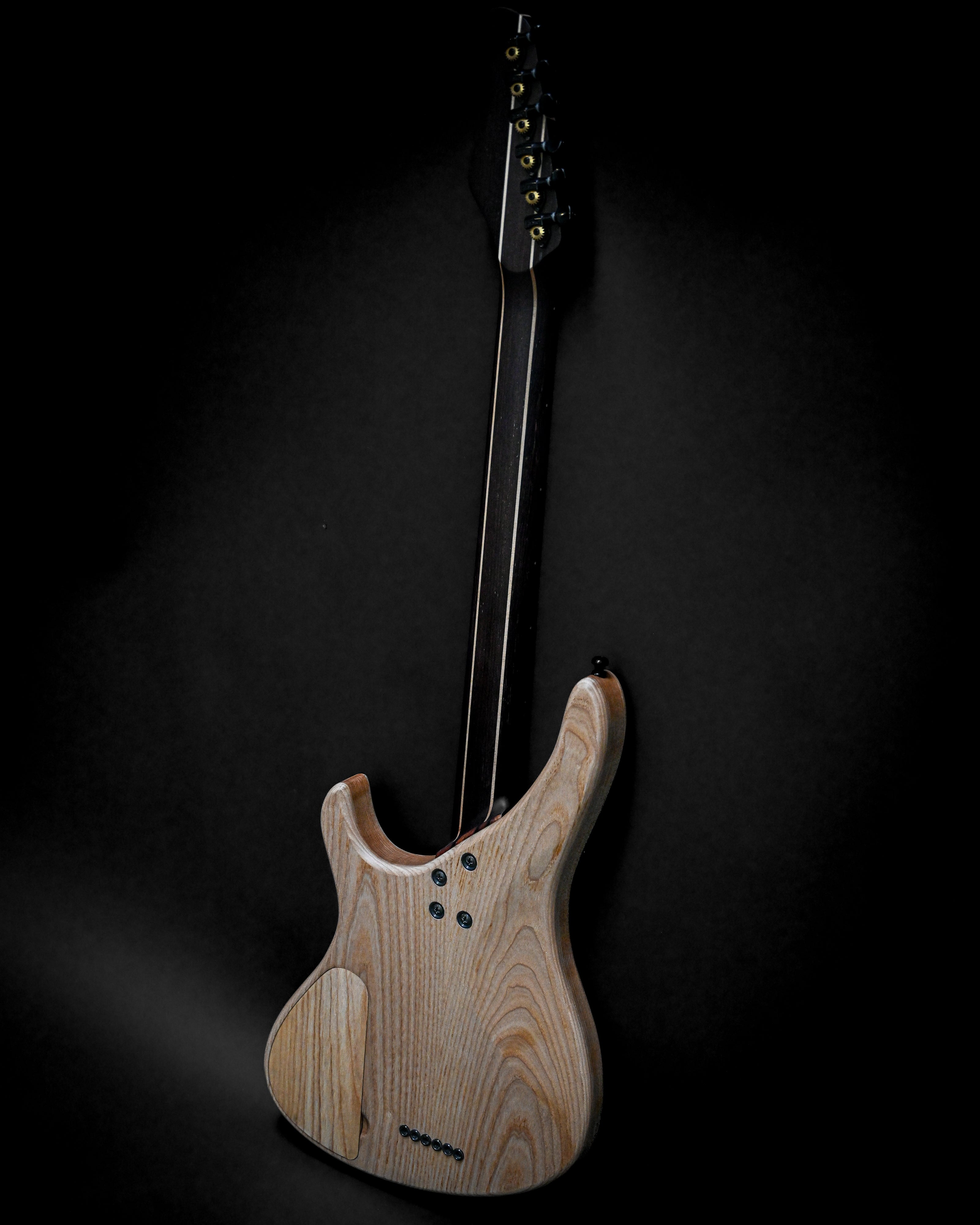 Rear view of Sarā 6 - Masterbuilt custom electric guitar showcasing premium craftsmanship and design.