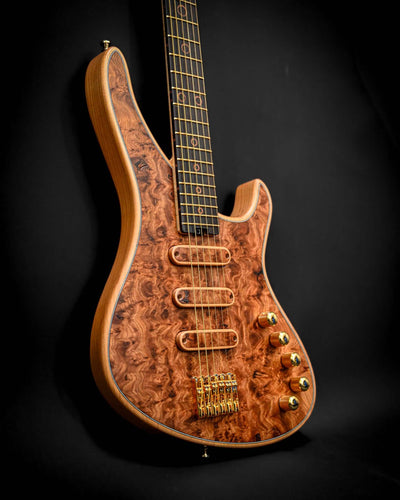 Profile view of the S5 Active - Elm Burl guitar demonstrating its sleek contours and detail in the wood.