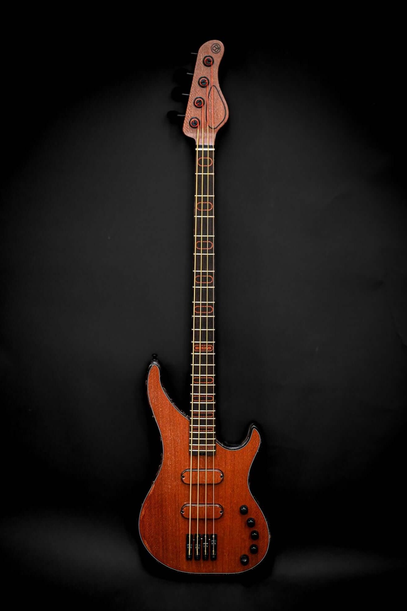 S3 Lacewood electric bass guitar, showcasing its elegant lacewood top and sleek design against a black background.