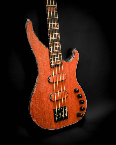 Front view of the S3 Lacewood bass guitar, highlighting the layout of its strings and controls.
