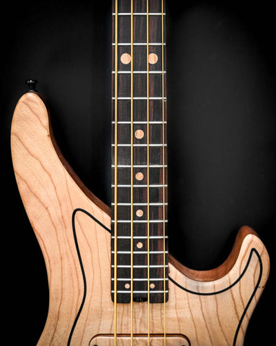 High angle shot of the M3 Maple bass guitar emphasizing its complete body structure.