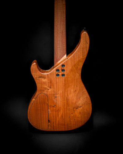 Close-up back view of M3 Maple bass guitar highlighting the smooth wood finish.