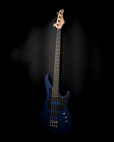 Vēa 4 - Essential bass guitar by Belforti in blue against dark background