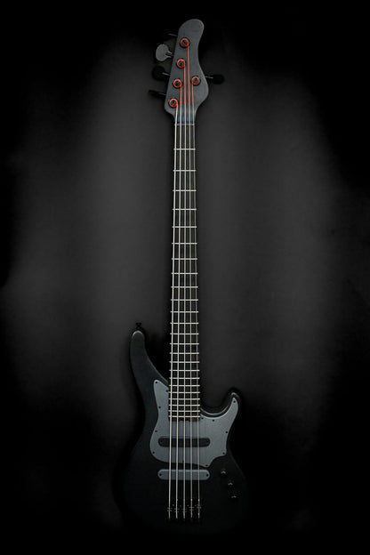 The E3 Lorraine Coal 5-string bass guitar by Belforti Instruments, showcasing its sleek design with a Lorraine Coal Grey finish against a dark backdrop.