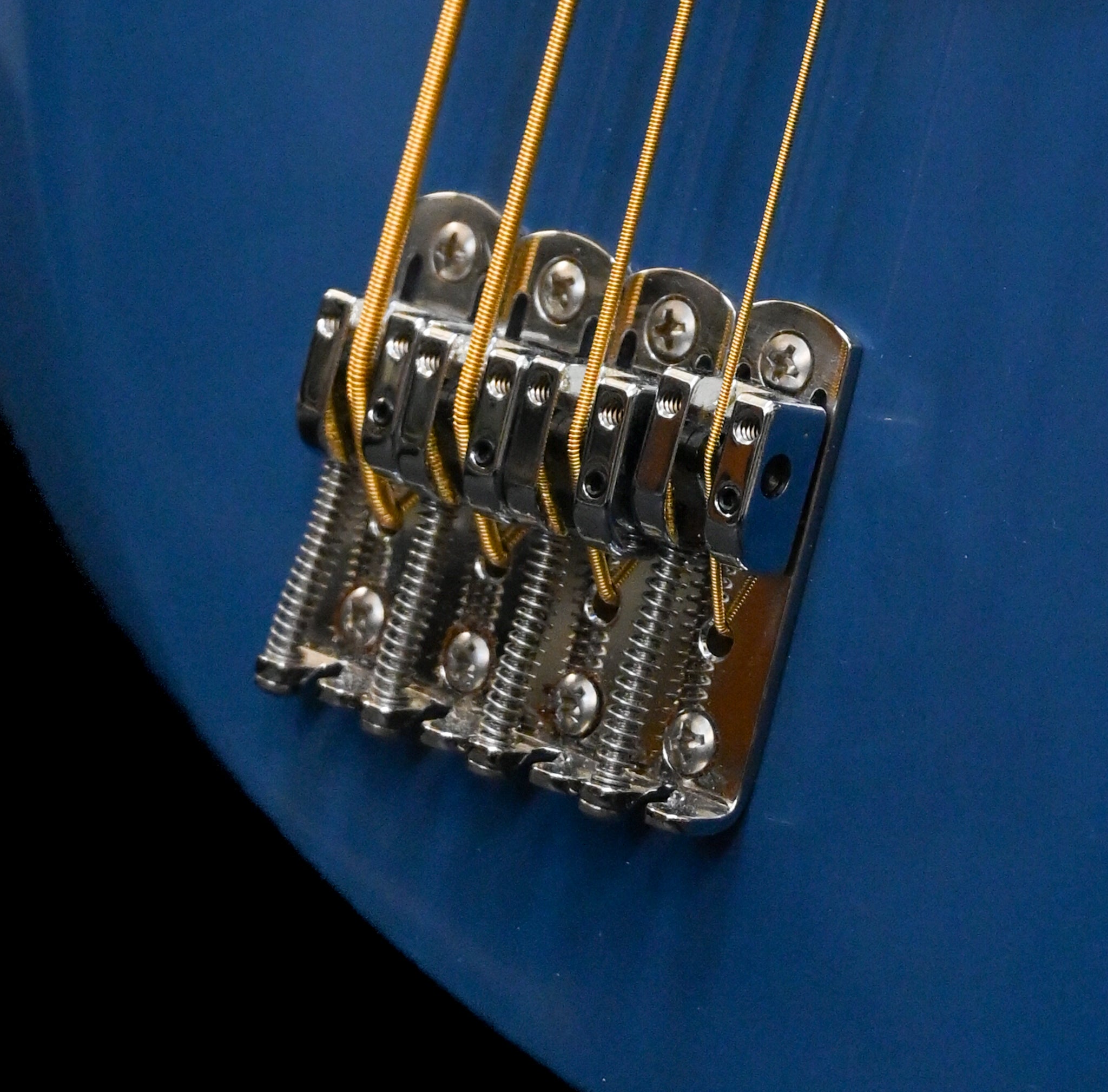 A detailed view of Hipshot's Single bass bridge on a Belforti E1 Bass, 4 string, made in france
