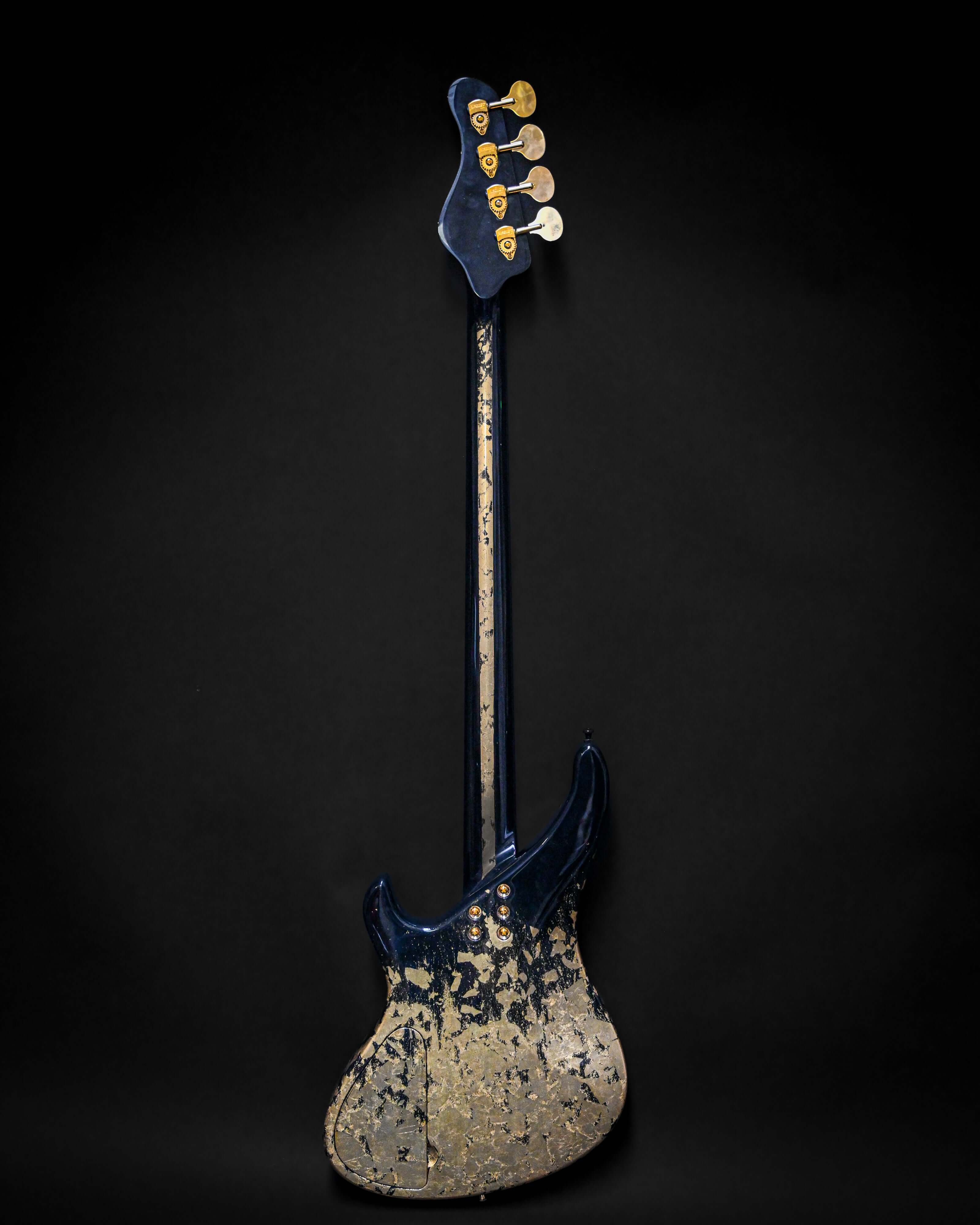 Rear view of Marē 4 - Essential bass guitar by Belforti, showcasing custom high-end luxury design with unique blue and gold finish.