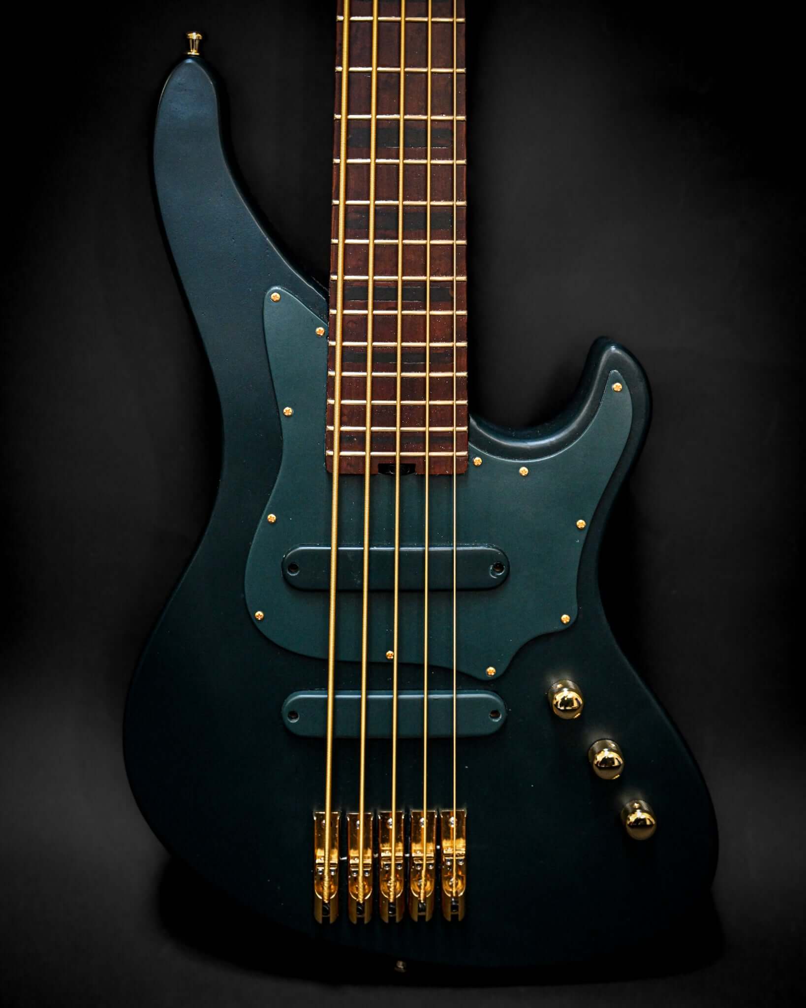 Marē 5 - Essential Belforti bass guitar showcasing sleek design and high-quality tonewoods for professional playability.