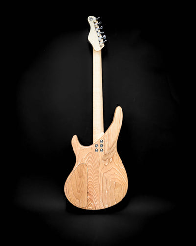 Back view of Belforti Yatē 6 - Masterbuilt bass guitar with natural wood finish