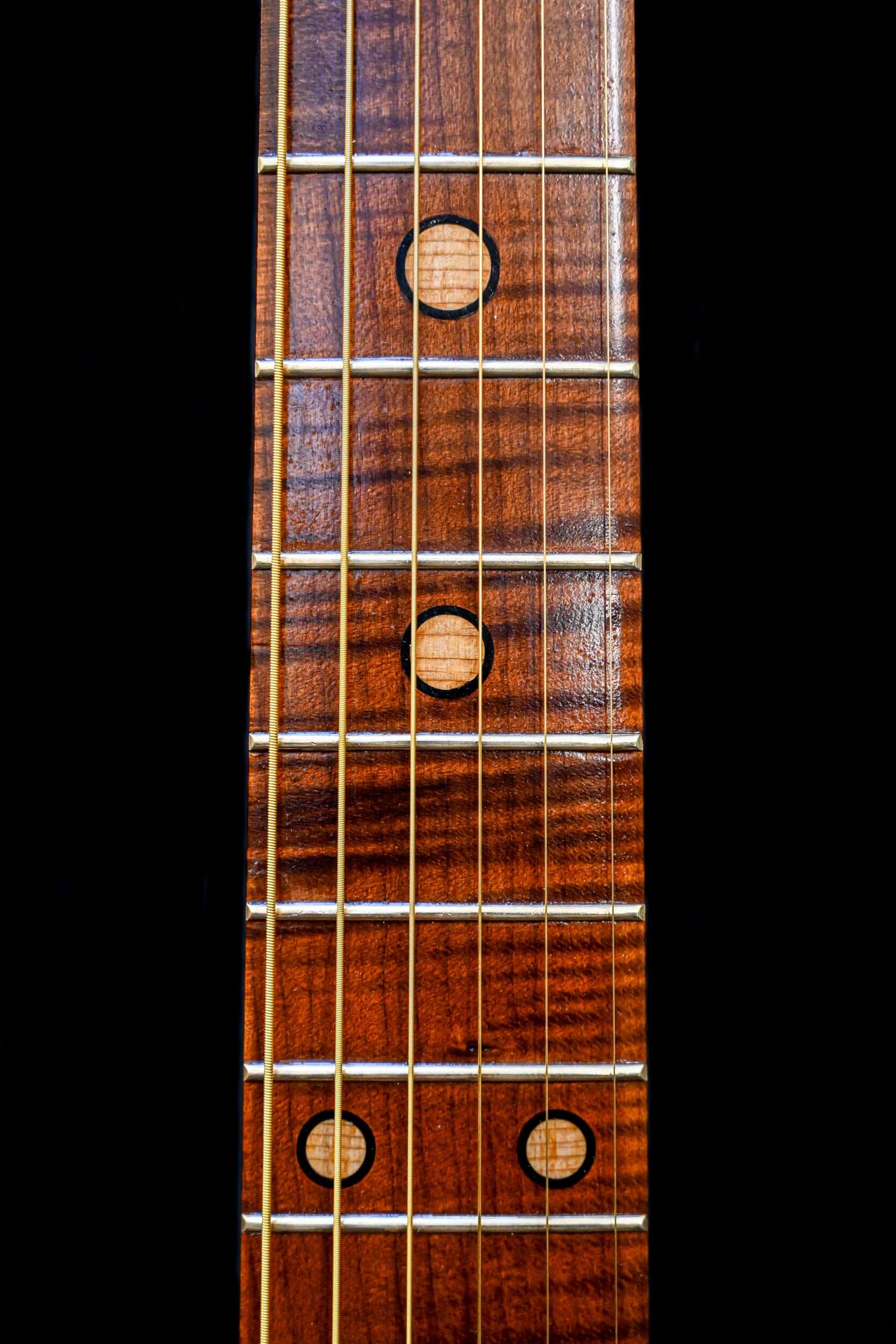A close up shot of the Roasted Maple Fretboard on the Belforti M7 Heritage, handcrafted in Paris France